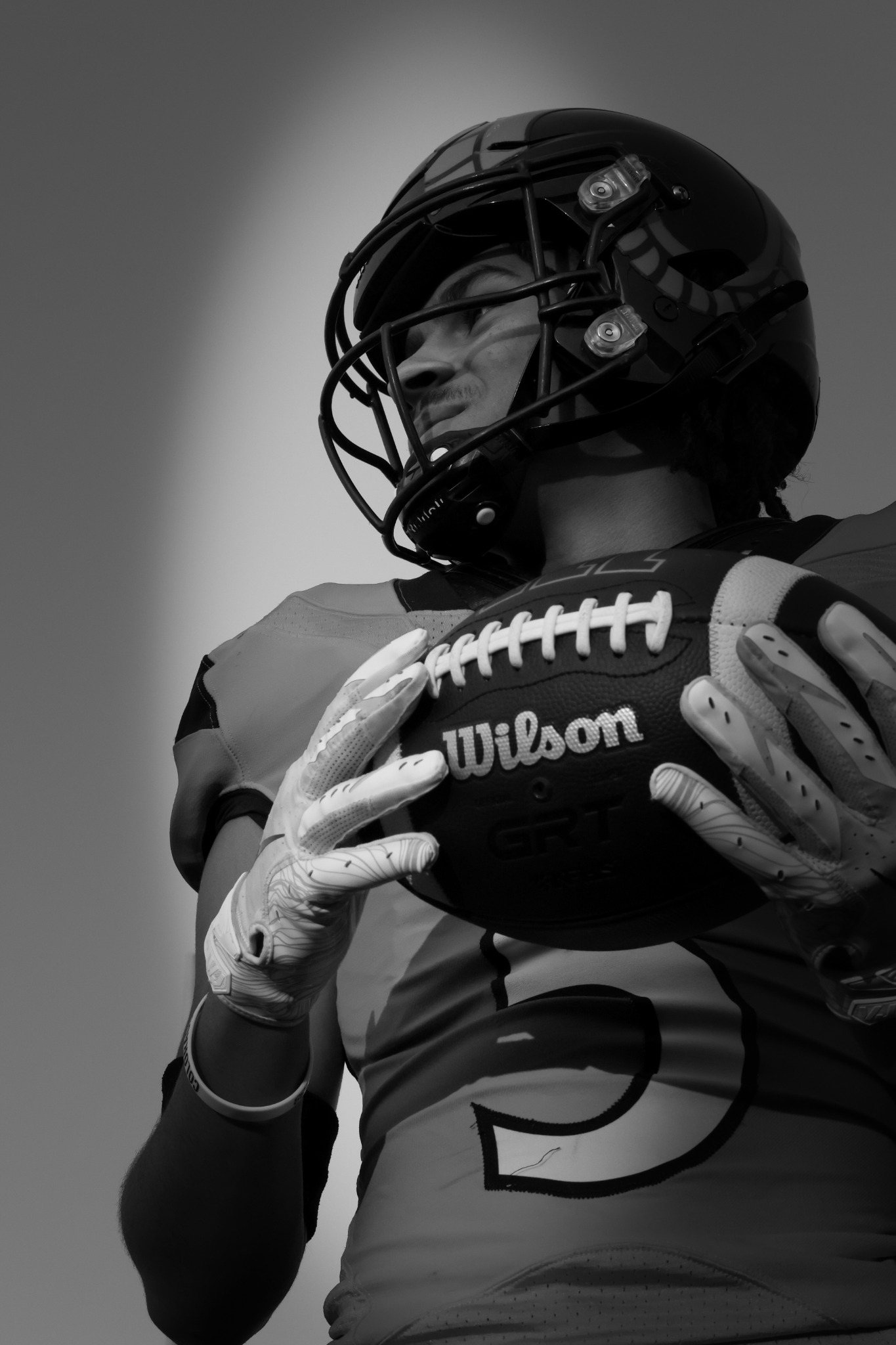 Dramatic black and white football portrait