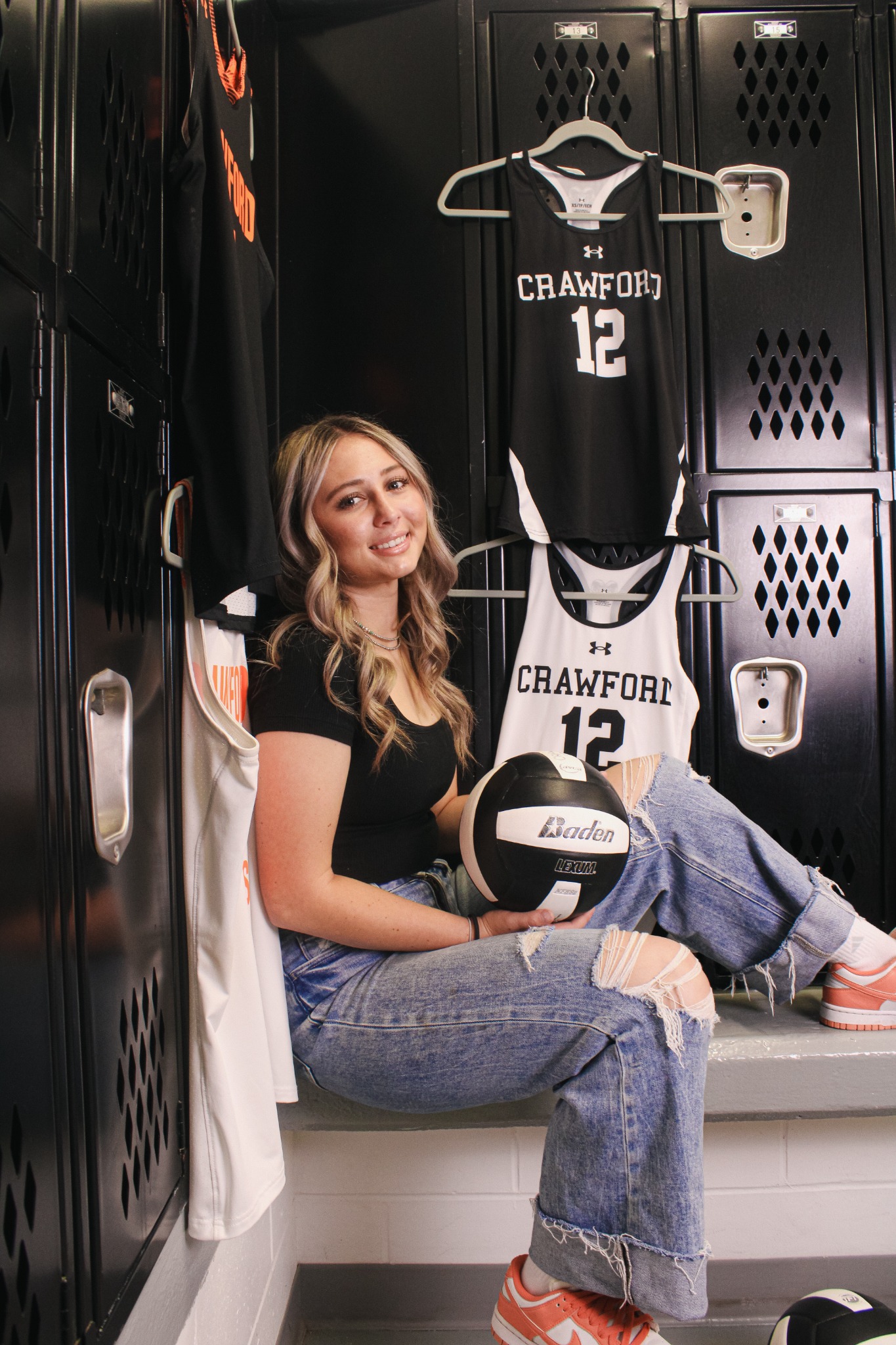 Senior volleyball portrait in locker room